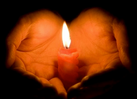 candle in cupped hand