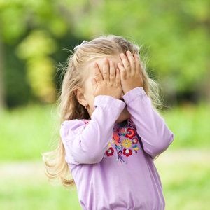 girl hiding eyes